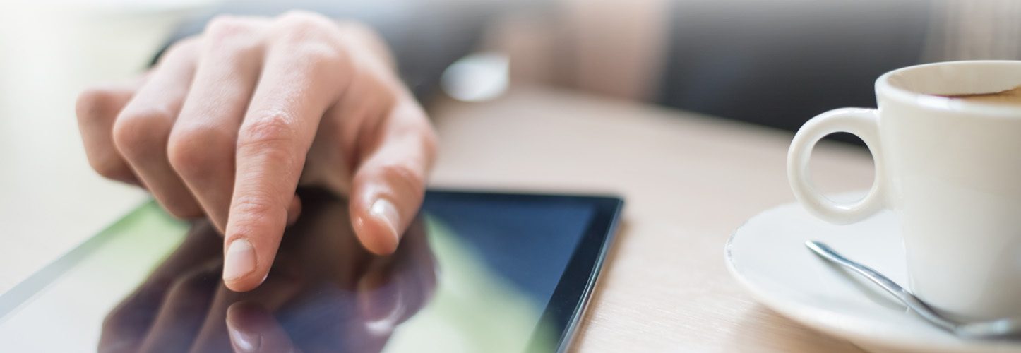 Person interacting with tablet device